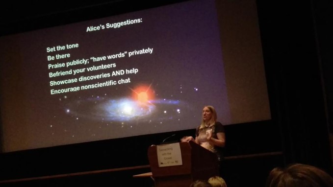 Alice Sheppard is giving a lecture. She has a dark slide showing a galaxy but also some community running tips, e.g. "Set the tone, be there, praise publicly, 'have words' privately, befriend your volunteers, showcase discoveries AND help, encourage nonscientific chat".