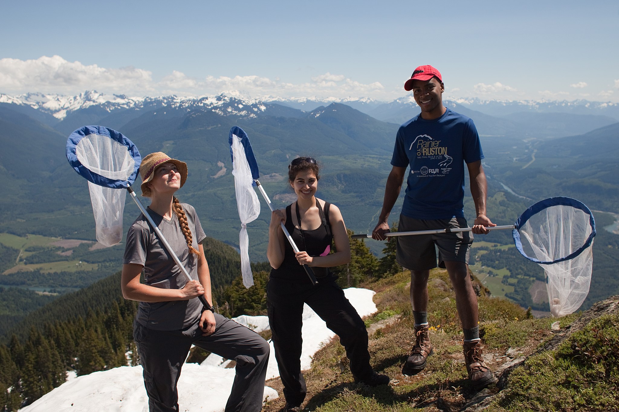 In this image the Cascades Butterfly Monitoring Project Team pose at the top of Sauk Mountain