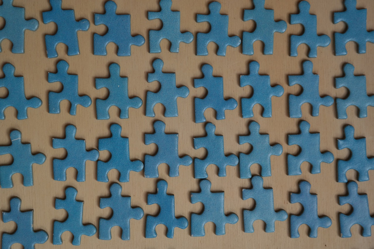 Pieces of a puzzle laid out on a table 