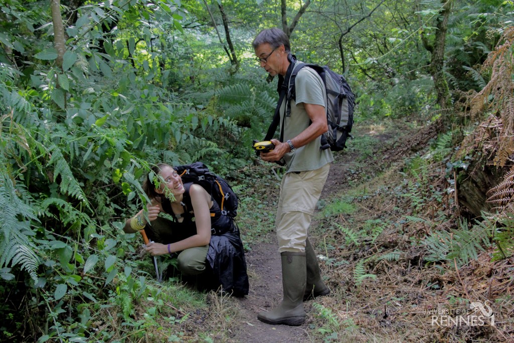 student and teacher doing observations in a forest